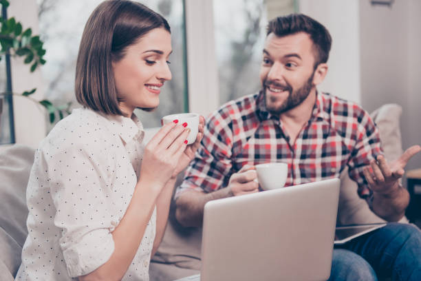 istock Creative young business people discussing project and drinking tea 945107124