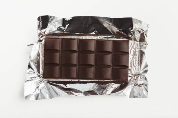 istock Bar of dark chocolate isolated on white 945107194