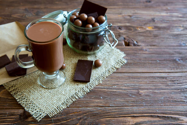 istock Chocolate cocktail with marshmallows on wooden background 945110464