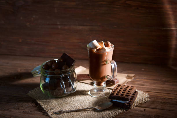istock Chocolate cocktail with marshmallows on wooden background 945110530
