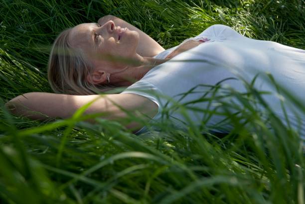 Woman  enjoys resting in the beautiful nature.