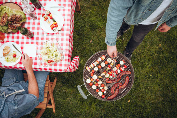 istock High angle of grilling person 945113854