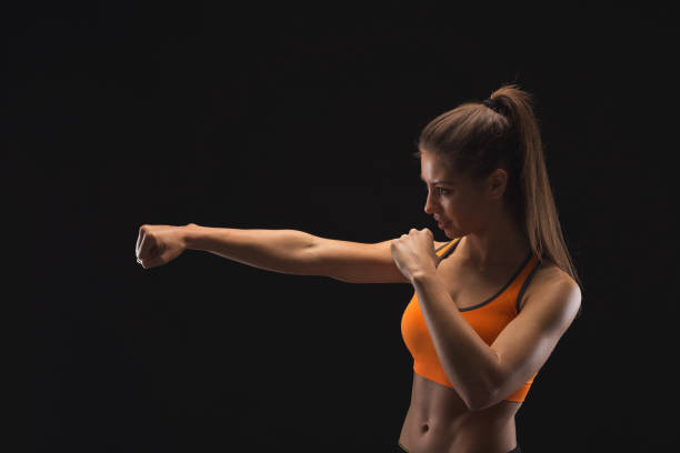 istock Athletic woman preparing for fight 945116154