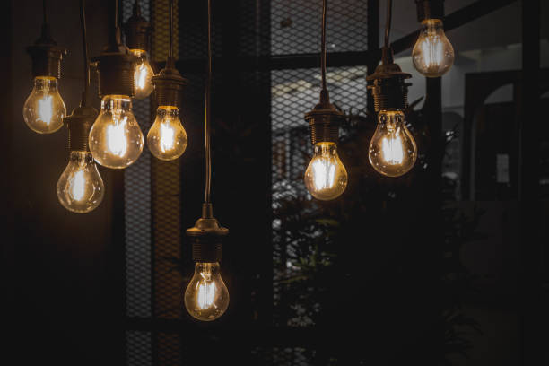 istock A glowing old light bulbs on the dark background 945116308