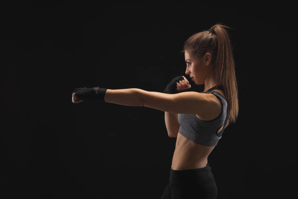 istock Gorgeous young woman with boxing bandage 945116330