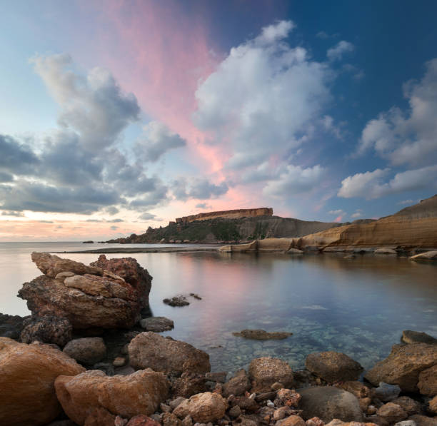 istock Dramatic sunset at the Gnejna bay, Malta 945116494
