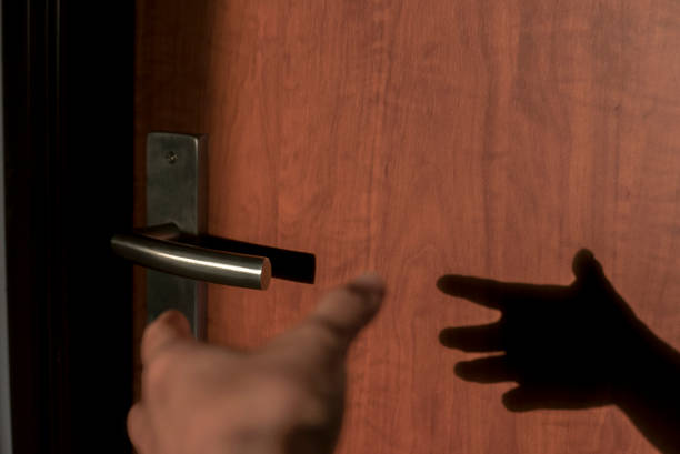 istock sunlight and silhouette on door 945117338