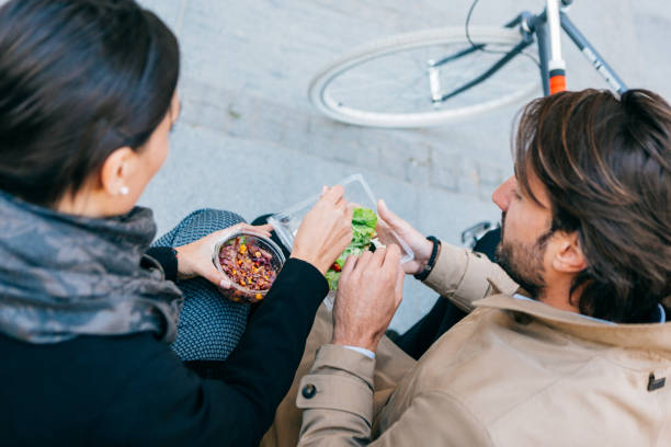 istock Business people having lunch outdoors 945117588