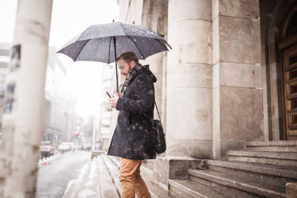 istock Ginger businessman using mobile phone outdoors 945120234