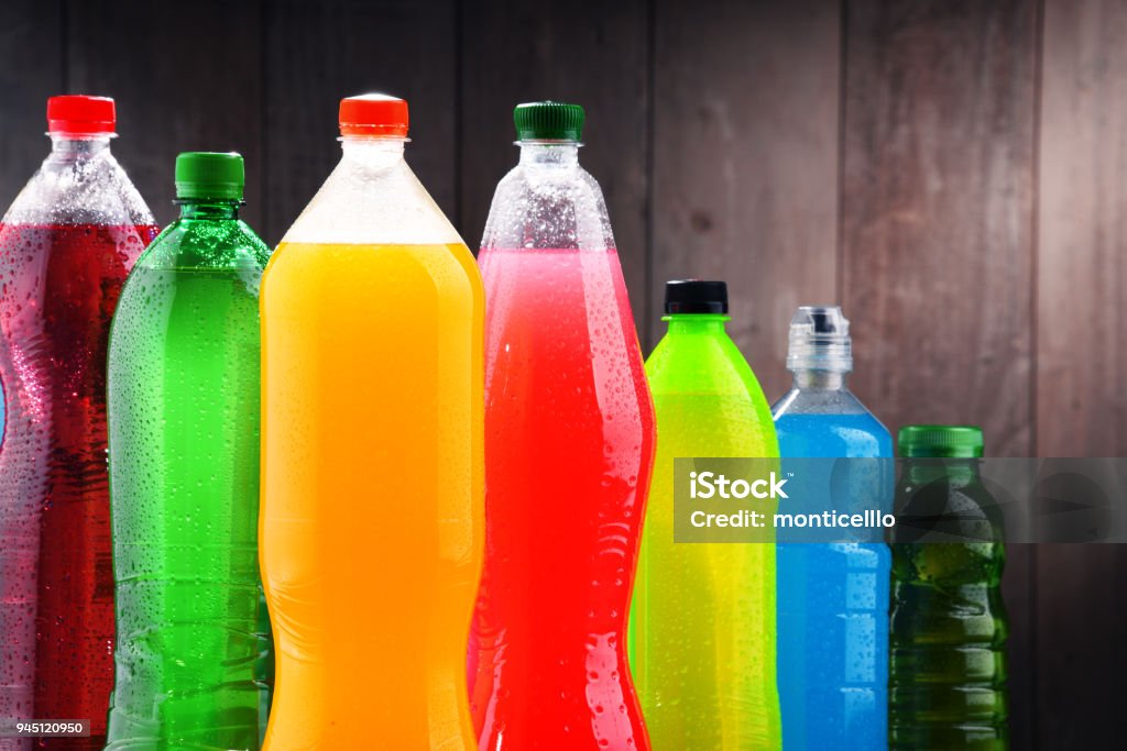 Plastic bottles of assorted carbonated soft drinks Plastic bottles of assorted carbonated soft drinks in variety of colors Drink Stock Photo