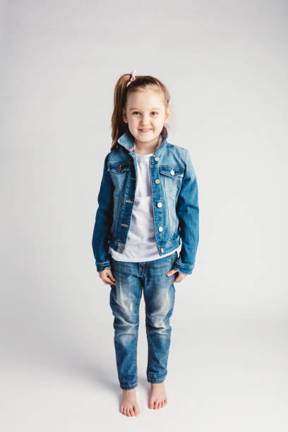 istock Girl in jeans clothes on white background. 945121098
