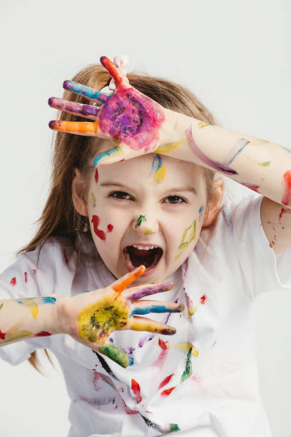 istock Little girl making funny faces. 945121130