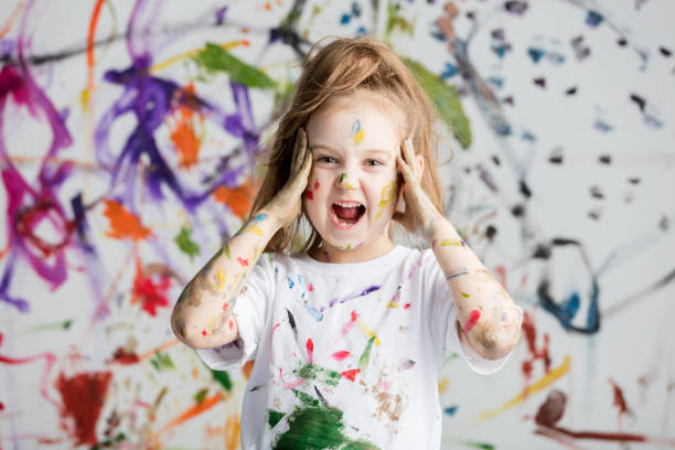 istock Shocked little girl grabbing her head 945121156