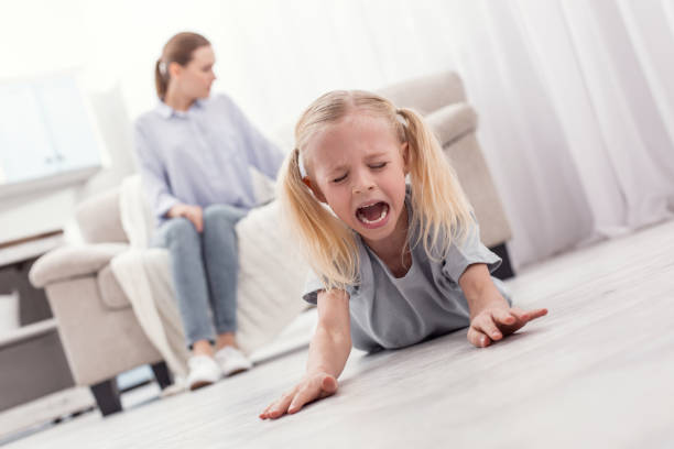 istock Wicked mischievous girl shouting in hysterics 945121476