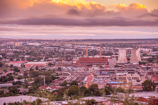 Bloemfontein City, Free State, South Africa- 30 March, 2018 : Part of Bloemfontein city from Naval Hill showing the railway section and electricity plant at sunset.