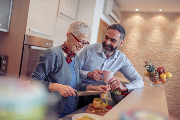 istock Romantic mature couple in the kitchen 945124572