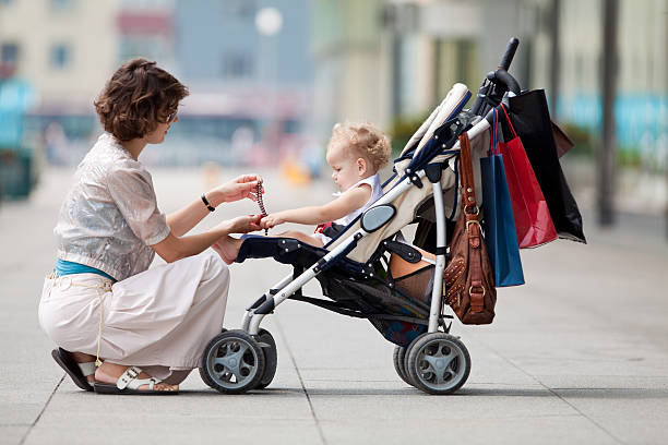 istock Baby in a stroller while her mother gives her a gift 94512791