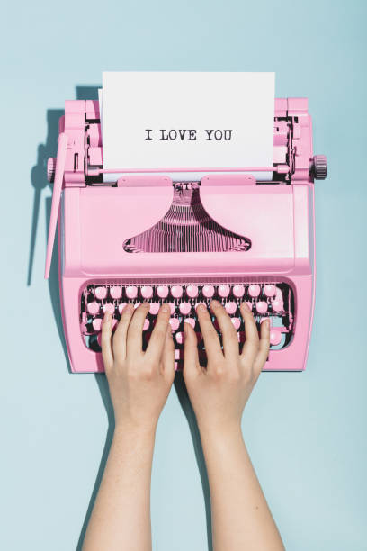 woman's hands writing "i love you" on a typewriter. - author writing retro revival women imagens e fotografias de stock