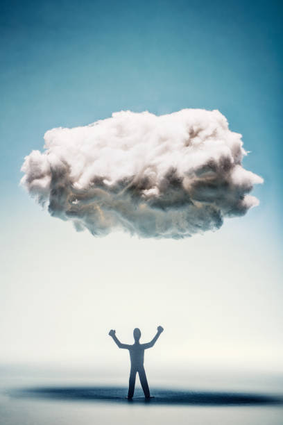 istock Angry man with clenched fists standing under a cloud. 945129374