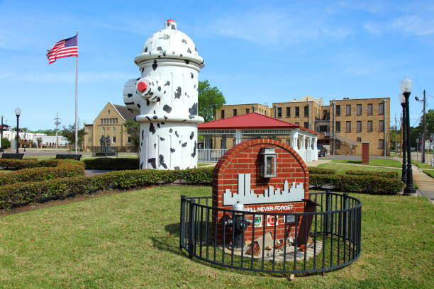 Fire Museum of Texas Beaumont, Texas, USA - April 10, 2018: Daytime view of the the world's largest working fire hydrant and the Texas Firefighter Memorial, a 9-11 Memorial in front of the museum. beaumont tx stock pictures, royalty-free photos & images