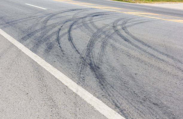 istock Abstract road background with tracks of tires 945133264
