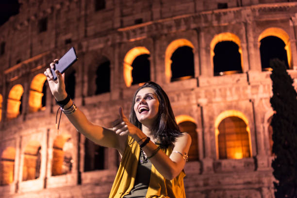 istock Smiling girl with phone 945136272