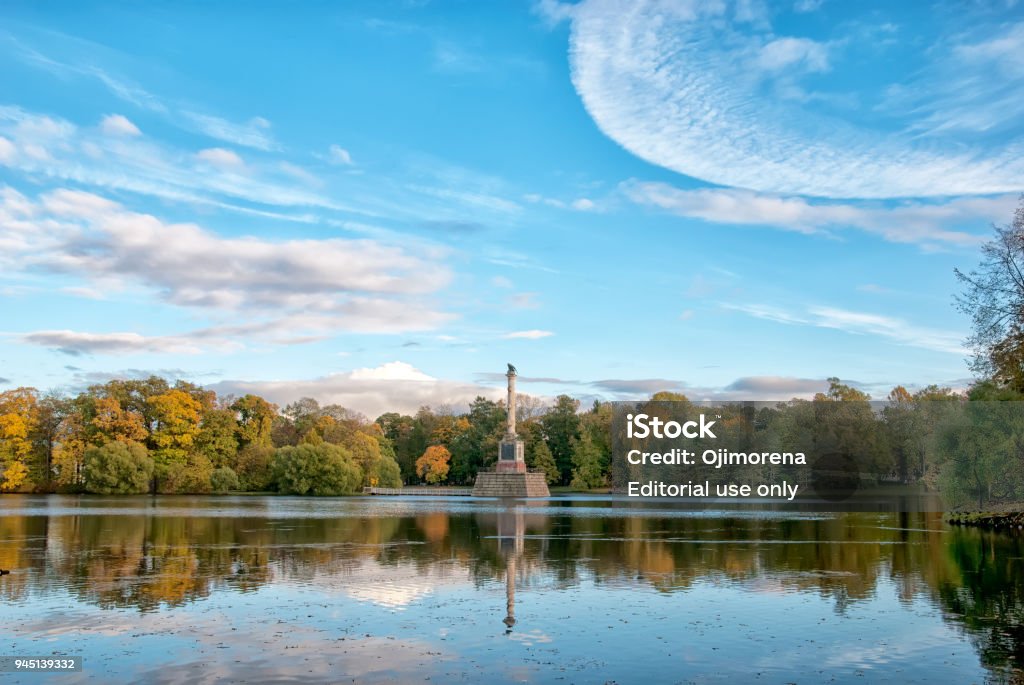 Chesme Column. Pushkin. Tsarskoye Selo. Russia Tsarskoye Selo, Saint-Petersburg, Russia - October 7, 2017: Autumn view of The Chesme Column on the Great Pond in the Catherine Park. Was built by Antonio Rinaldi over 1774-1778 Architectural Column Stock Photo