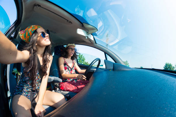 istock Women having fun in a road trip 945139388