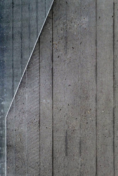 istock grey cast concrete textured background with vertical wood pattern and angled white line and traces of blue paint 945139480