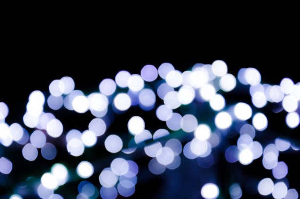 istock Colored lights, garlands. Blurred photo. Celebratory background. 945141016