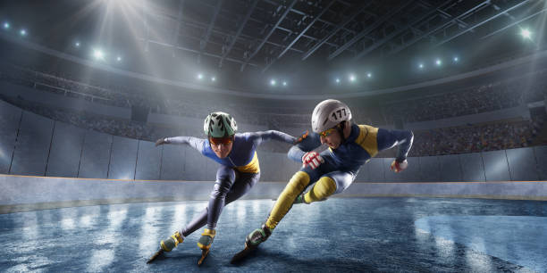 gli atleti di short track scivolano nell'arena di ghiaccio professionale. caduta di uno skater - sciatore velocità foto e immagini stock