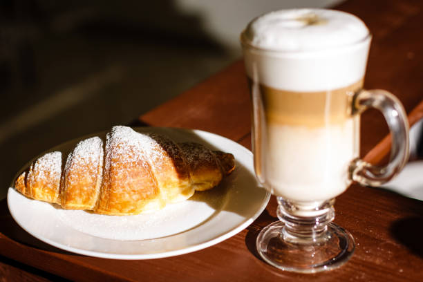 istock Fresh croissant on a black slate background. Copy space 945144200