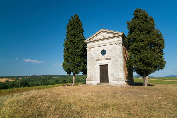istock Tiny Vitale chapel in a golden wheat field in Tuscany 945144346