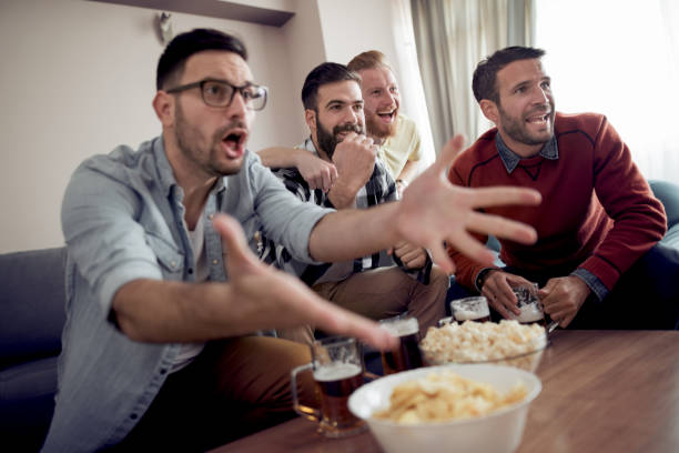 istock Happy young friends having fun at home 945144862