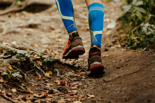 istock closeup dirty foot runner in blue compression calf sleeves 945147918