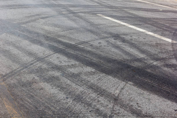 istock Abstract road background with tracks of tires 945149016