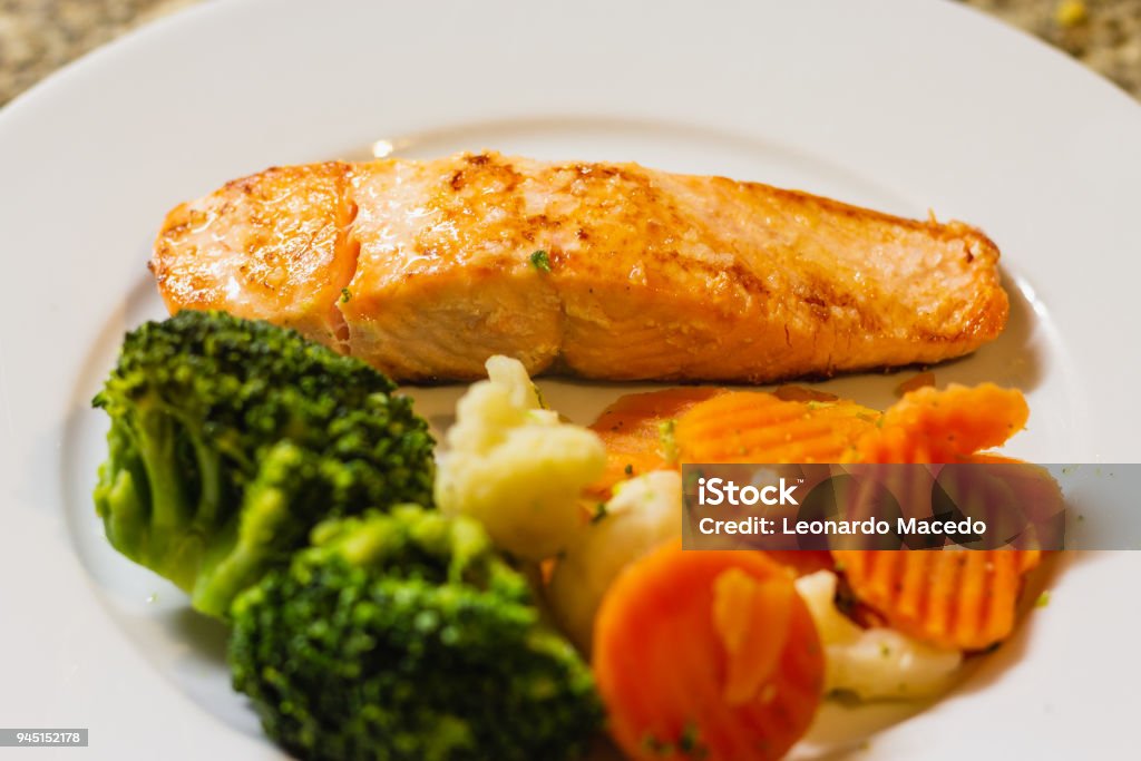 Grilled Salmon With vegetables Grilled salmon dish with steamed vegetables. Close-up Stock Photo