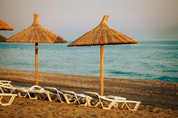 istock A straw umbrella on a beach 945152360