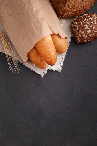 istock white, gray and rye bread, baguette, roll with sesame seeds 945156234