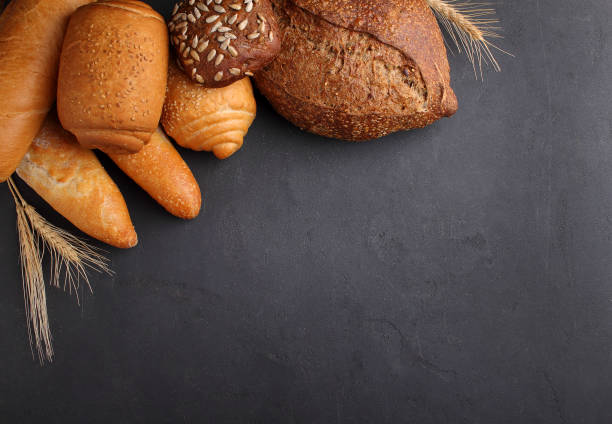 white, gray and rye bread, baguette, roll with sesame seeds