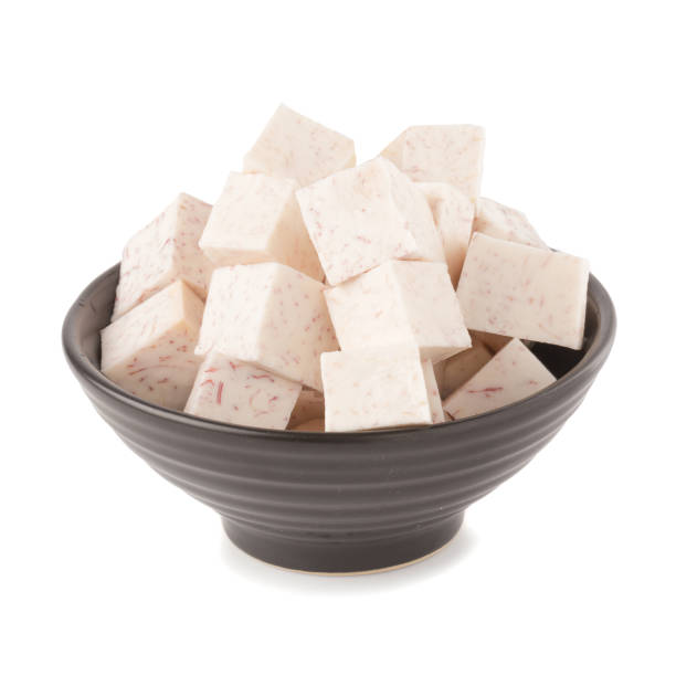 istock Black bowl of Cube taro root isolated on a white background 945159908
