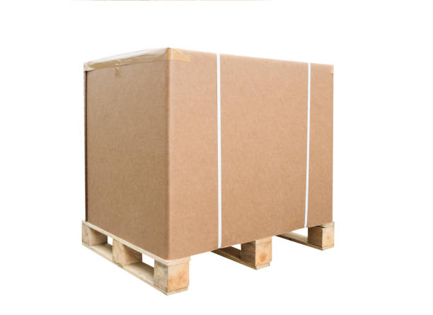 istock Cardboard boxes on a pallet. Isolated on white background. Large box for export goods 945165710