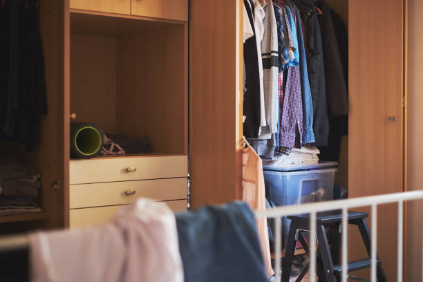 istock Untidy home, bedroom and closet 945165896