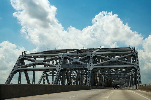 Driving across the Huey P. Long Bridge over the Mississippi River in Louisiana, USA; Concept for road trip in the USA and Louisiana