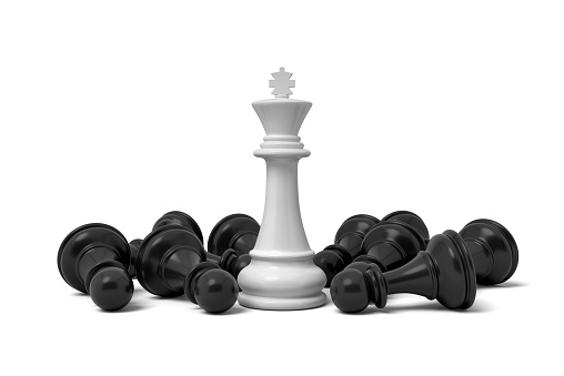 3d rendering of a white standing king chess piece surrounded by fallen pawns. Board games. Chess pieces by importance. Win over weaker opponent.