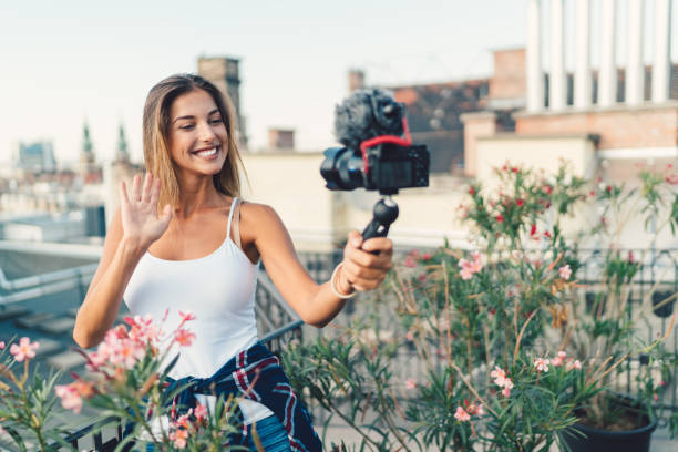 istock Tourist in Budapest vlogging at rooftop terrace 945170066