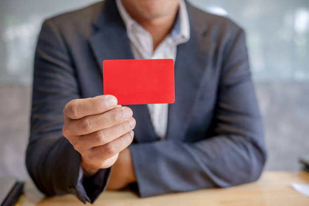 istock Businessmen holding red credit card 945173968