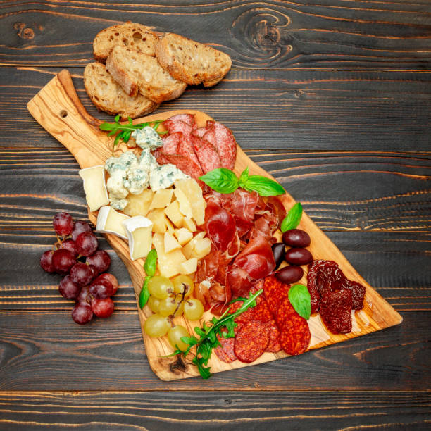 istock Cold meat cheese plate with salami sausage, prosciutto and cheese 945182080