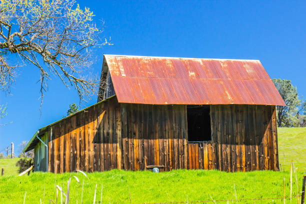 istock Vintage Wooden Barn With Rusty Tin Roof 945191912