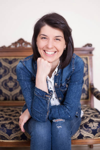 istock Beautiful casual woman smiling on a white background. 945192990